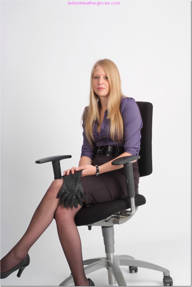 Leggy Blonde Secretary Hayley Puts On A Tight Black Pair Of Leather Gloves  